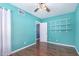 This bedroom offers natural light, hardwood floors, and closet space at 9603 N 1St Ave, Phoenix, AZ 85021