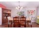Elegant dining room featuring a wood table with seating, hardwood floors, and natural light at 9603 N 1St Ave, Phoenix, AZ 85021
