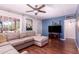 Comfortable living room with a large sectional sofa, wood floors, and an open layout at 9603 N 1St Ave, Phoenix, AZ 85021