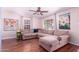 Inviting living room features a large sectional sofa, wood floors, and natural light at 9603 N 1St Ave, Phoenix, AZ 85021