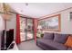 Cozy room offering carpeted floors, access to the backyard, and an additional window at 9603 N 1St Ave, Phoenix, AZ 85021