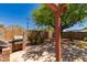Outdoor kitchen area featuring a built-in brick grill and mature landscaping at 9603 N 1St Ave, Phoenix, AZ 85021