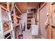 Interior view of a shed featuring shelves, tools, storage, and an old freezer at 9603 N 1St Ave, Phoenix, AZ 85021
