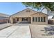 Large backyard with gravel, a concrete slab, and a covered patio for relaxed outdoor living at 1026 E Julie Ave, San Tan Valley, AZ 85140