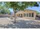 Backyard featuring a gravel yard, concrete patio, and lounge furniture at 1026 E Julie Ave, San Tan Valley, AZ 85140
