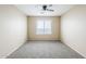 Comfortable bedroom with neutral carpet and bright window provides a relaxing space at 1026 E Julie Ave, San Tan Valley, AZ 85140