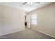 Bedroom with neutral tones, carpet, and a view into another room at 1026 E Julie Ave, San Tan Valley, AZ 85140