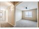 Cozy bedroom with neutral carpet and bright window provides a relaxing space at 1026 E Julie Ave, San Tan Valley, AZ 85140