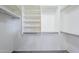 Organized walk-in closet with shelving and rods to neatly store clothing at 1026 E Julie Ave, San Tan Valley, AZ 85140