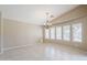 Spacious dining room with natural light, tile flooring, and an elegant chandelier at 1026 E Julie Ave, San Tan Valley, AZ 85140