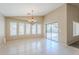 Bright dining area featuring large windows and a modern chandelier at 1026 E Julie Ave, San Tan Valley, AZ 85140