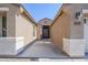 View of the entry way to the front door of this tan-colored home at 1026 E Julie Ave, San Tan Valley, AZ 85140