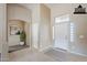 Home foyer featuring an arched doorway, white front door with side windows, and tile flooring at 1026 E Julie Ave, San Tan Valley, AZ 85140
