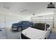 Spacious garage featuring two cars with an automatic door at 1026 E Julie Ave, San Tan Valley, AZ 85140