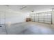 Spacious two-car garage with concrete floor and door to the house at 1026 E Julie Ave, San Tan Valley, AZ 85140