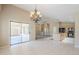 Open-concept layout connecting dining and kitchen, featuring updated appliances and countertops at 1026 E Julie Ave, San Tan Valley, AZ 85140