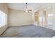 Neutral living room with carpet, high ceilings and open concept floor plan at 1026 E Julie Ave, San Tan Valley, AZ 85140