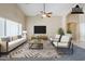Bright living room with vaulted ceilings, modern furnishings, and neutral tones at 1026 E Julie Ave, San Tan Valley, AZ 85140