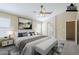 Staged main bedroom with ceiling fan and ensuite bathroom entrance at 1026 E Julie Ave, San Tan Valley, AZ 85140