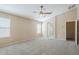 Main bedroom with an ensuite bathroom and ceiling fan at 1026 E Julie Ave, San Tan Valley, AZ 85140