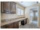 Home office featuring built-in cabinets and granite counters perfect for working from home at 1026 E Julie Ave, San Tan Valley, AZ 85140