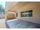 Covered patio features a concrete floor, exterior wall, and ample space for outdoor entertaining at 1026 E Julie Ave, San Tan Valley, AZ 85140