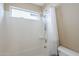 Bright shower and tub combo with neutral-toned walls and modern fixtures, including a detachable showerhead at 1026 E Julie Ave, San Tan Valley, AZ 85140