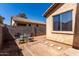 Small backyard area with cinder block wall and stone paver path to seating area at 1130 E Ferrara St, San Tan Valley, AZ 85140