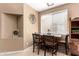 Cozy dining area with large window and space for a kitchen table at 1130 E Ferrara St, San Tan Valley, AZ 85140