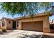 Charming single-story home featuring low maintenance desert landscaping and a two car garage at 1130 E Ferrara St, San Tan Valley, AZ 85140