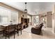 Inviting living area featuring natural light, tile flooring and neutral colors throughout at 1130 E Ferrara St, San Tan Valley, AZ 85140