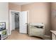 Versatile room with toys, a changing table, and access to the laundry room at 1130 E Ferrara St, San Tan Valley, AZ 85140