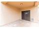 Covered back patio with tiled flooring and sliding glass door leading to the indoors at 11419 E Ellis St, Mesa, AZ 85207
