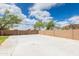 Spacious backyard patio with block wall fencing and ample space for outdoor entertaining at 11419 E Ellis St, Mesa, AZ 85207