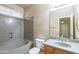 This bathroom features a shower-tub combo with a granite surround and a single sink vanity at 11419 E Ellis St, Mesa, AZ 85207