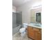 This bathroom features a shower-tub combo with a granite surround and a single sink vanity at 11419 E Ellis St, Mesa, AZ 85207