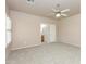 This bedroom features neutral walls, carpet flooring, large windows with shutters, and a ceiling fan at 11419 E Ellis St, Mesa, AZ 85207
