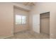 Bedroom featuring neutral paint, carpet, and a sliding door closet at 11419 E Ellis St, Mesa, AZ 85207