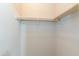 A view inside the well-lit closet features a rod for hanging clothes at 11419 E Ellis St, Mesa, AZ 85207