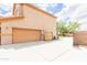 Wide driveway leading to a two-car garage, providing ample parking space and backyard access at 11419 E Ellis St, Mesa, AZ 85207
