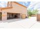 Exterior view of a two-story home with an attached garage and gate access to the backyard at 11419 E Ellis St, Mesa, AZ 85207