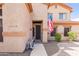 Inviting front entrance with security door, decorative stone, and neat, low-maintenance landscaping at 11419 E Ellis St, Mesa, AZ 85207
