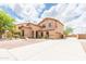Beautiful two-story home with a well-maintained yard, spacious driveway, and attached garage at 11419 E Ellis St, Mesa, AZ 85207