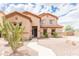 Attractive two-story home with manicured landscaping, and a welcoming front entrance at 11419 E Ellis St, Mesa, AZ 85207