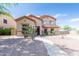 Lovely two-story home featuring desert landscaping and a walkway leading to the front entrance at 11419 E Ellis St, Mesa, AZ 85207
