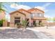 Charming two-story home featuring desert landscaping and a walkway leading to the front door at 11419 E Ellis St, Mesa, AZ 85207
