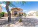 Beautiful two-story home with a desert-landscaped front yard and a charming walkway at 11419 E Ellis St, Mesa, AZ 85207