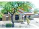 Charming two-story home with desert landscaping and a well-manicured front yard and walkway at 11419 E Ellis St, Mesa, AZ 85207