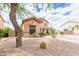 Charming two-story home with desert landscaping and a well-manicured front yard and walkway at 11419 E Ellis St, Mesa, AZ 85207