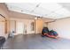 Well-lit garage with ample storage space, suitable for vehicles and equipment at 11419 E Ellis St, Mesa, AZ 85207